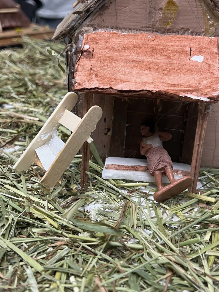 Close up of Native American Home doorway with figurine in doorway