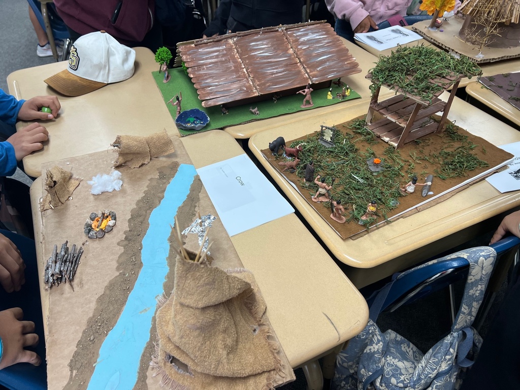 Native American Home Models using Popsicle sticks and greenery showing waterway and sand and teepee