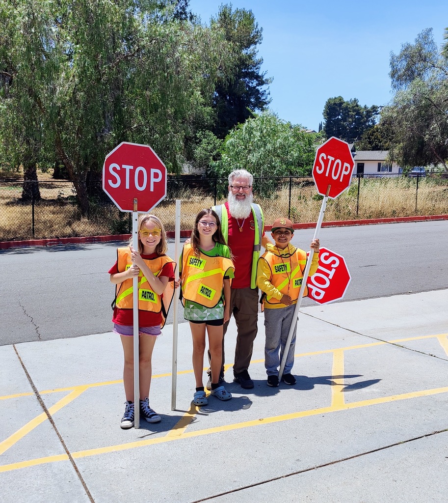 Mr. Boyce with Safety Patrol Students on a crosswalk