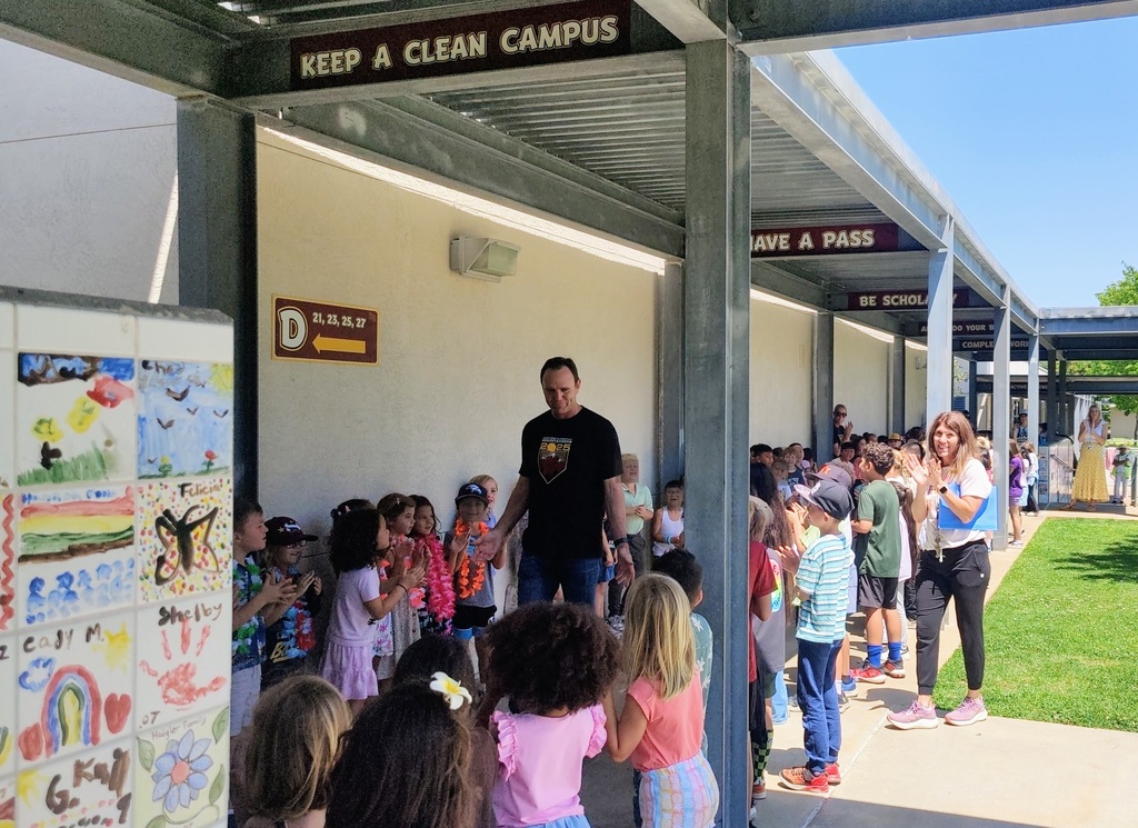 Mr. Lyche being clapped out by more 2nd grade students down the hallway