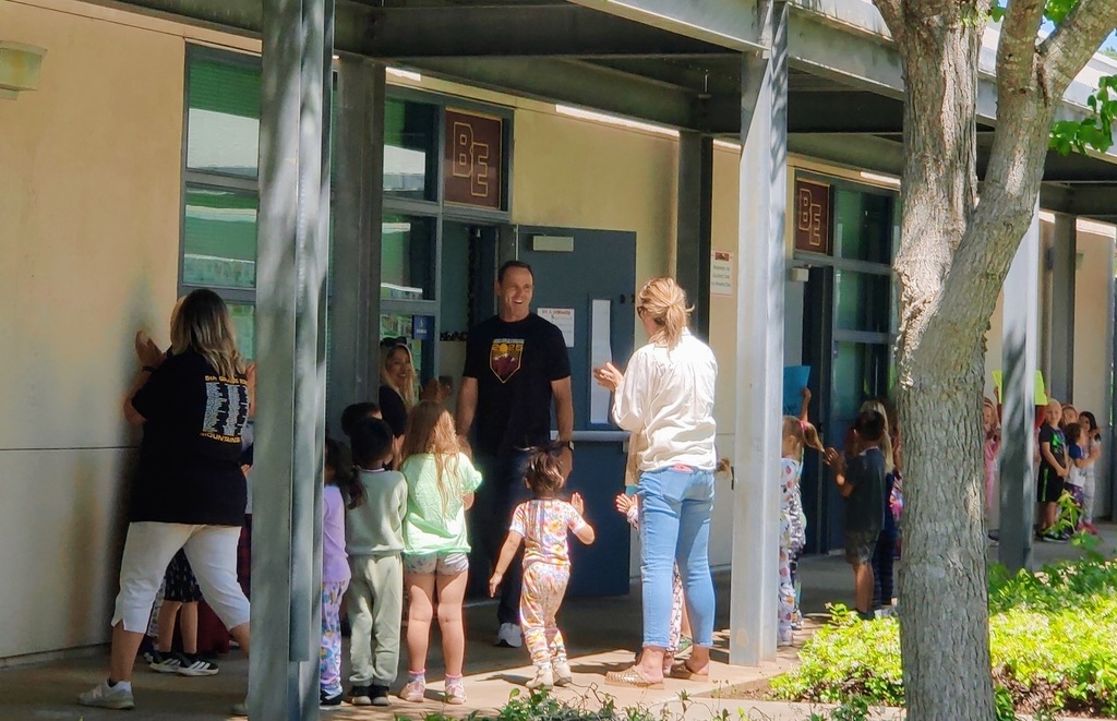 Mr. Lyche being clapped out by more TK students