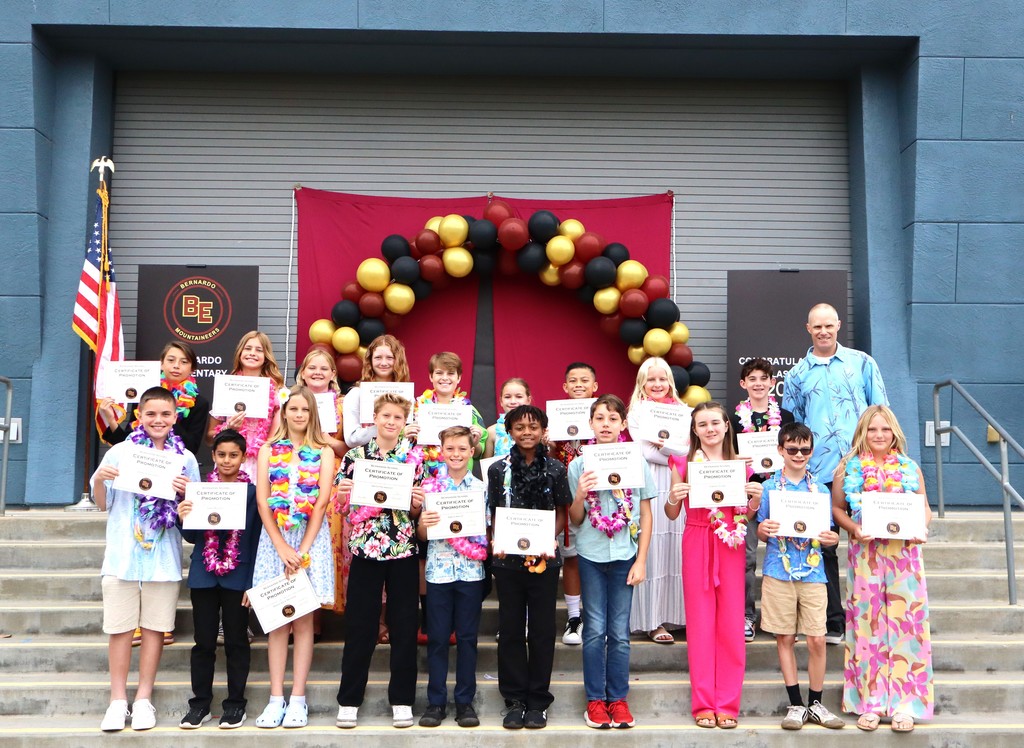 Mr. Oden on stage with his promoted 5th grade students