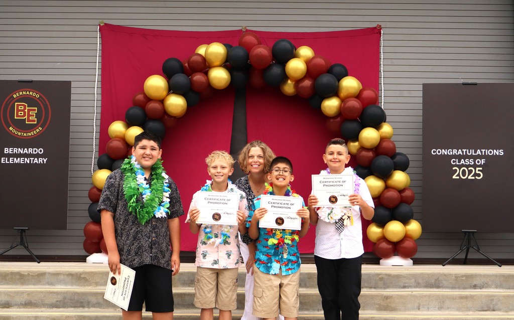 Mrs. Leedom on stage with her 4 promoted students