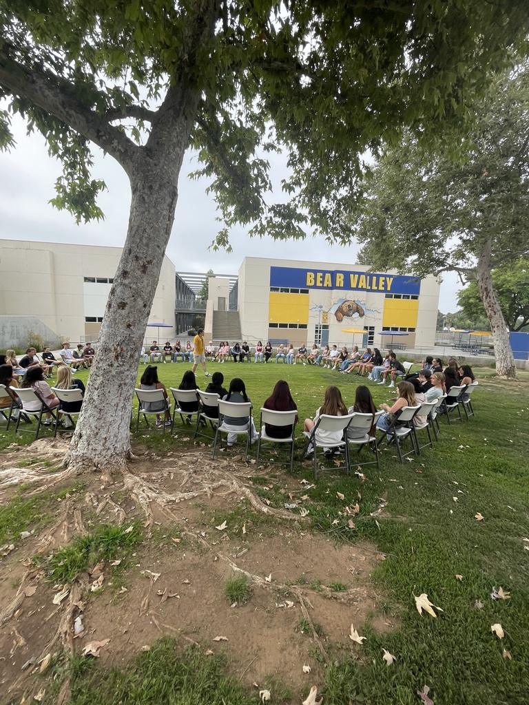 Mr. Drew talking with students