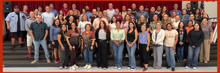 A serious group photo panorama of Mission's faculty and staff