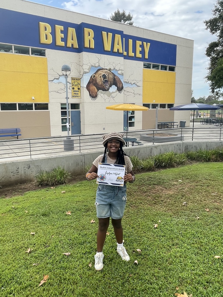 Picture of student with award