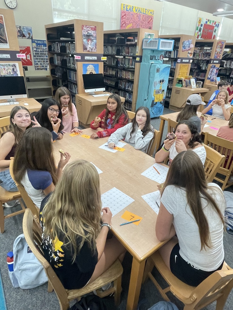 Students sitting at table in student advisory meeting
