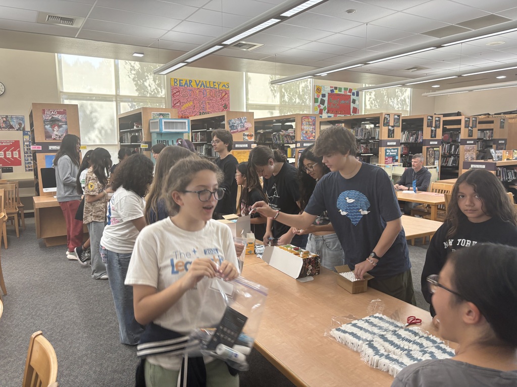 Students putting togethr hygiene kits as a service project.