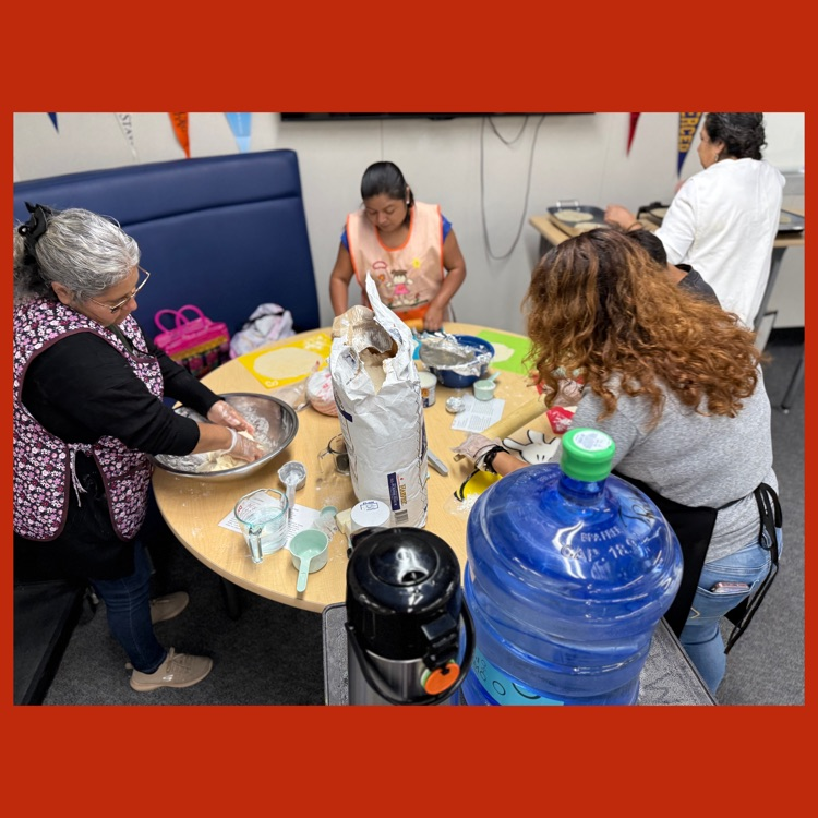 A photo of some of our Wildcat parents preparing tortillas