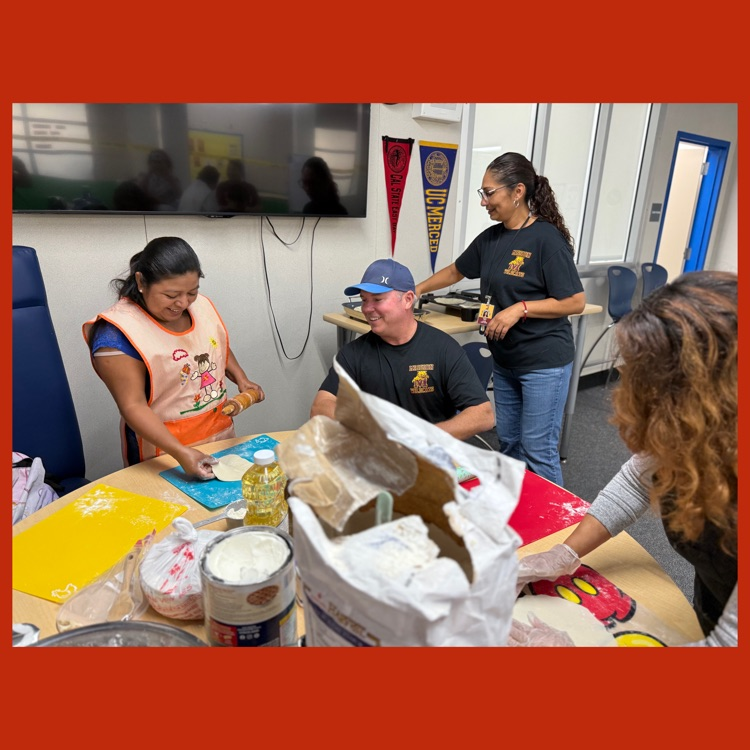 A photo of our Principal, Mr. Hoff, helping our Wildcat parents prepare tortillas