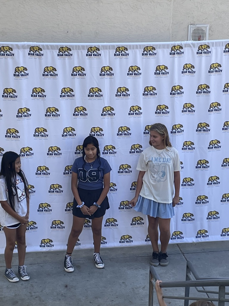 three student performing a skit
