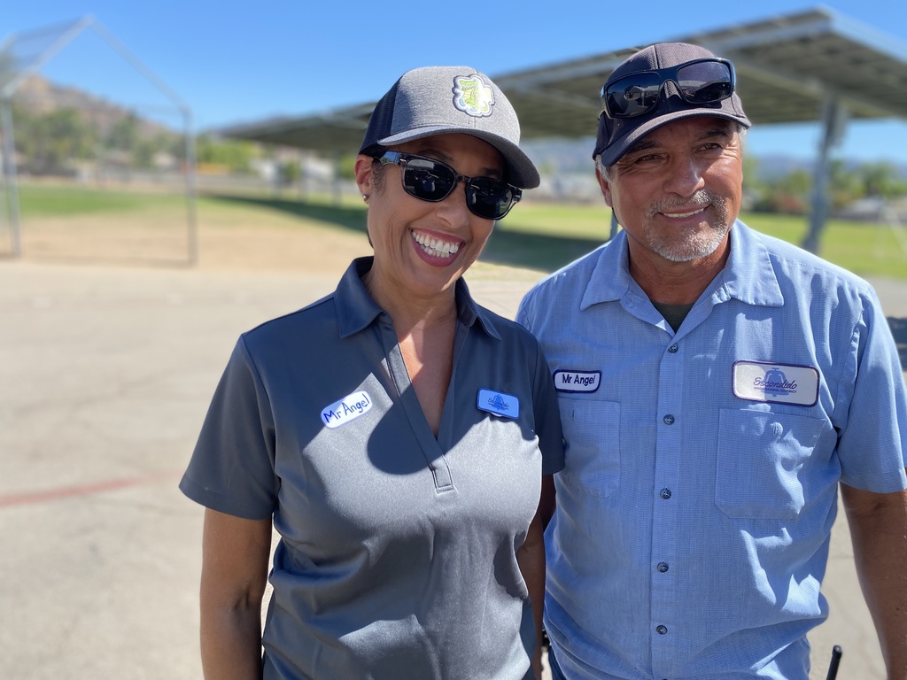 GV's custodian and Ms. Lopes our teacher they are both wearing blue shirts