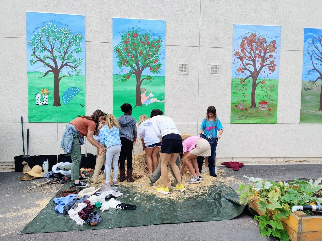 Students & Parents building scarecrows