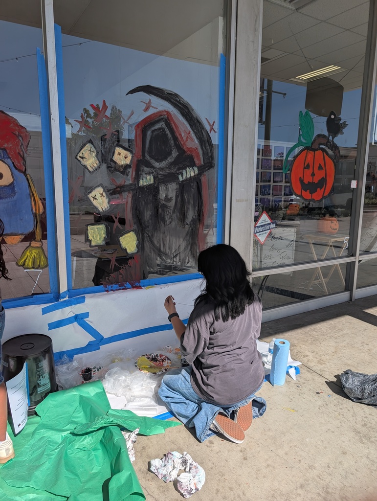Sophia Ranion working on her grim reaper Halloween painting.