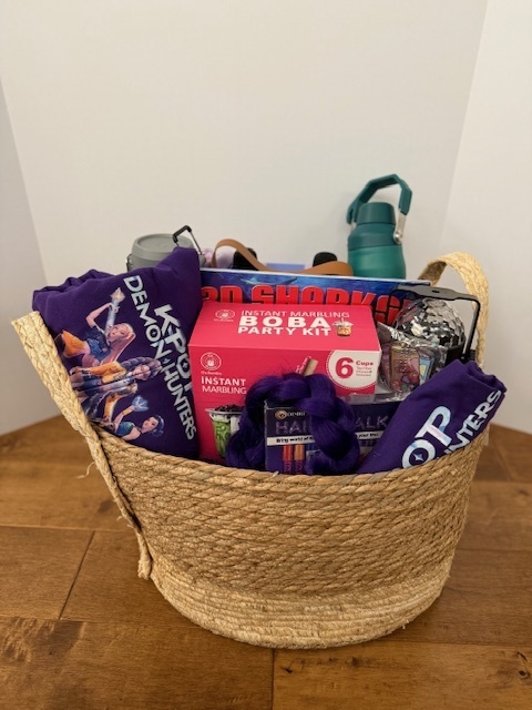 Basket with various drinking & clothing items
