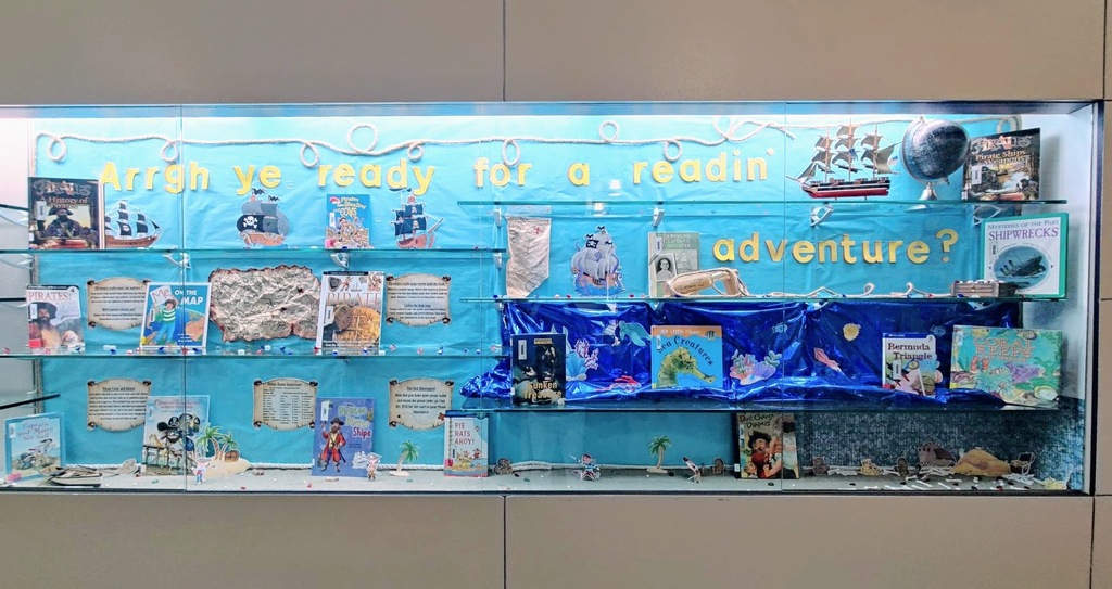 Library display of pirate books "Arrgh ye ready for a readin adventure?"