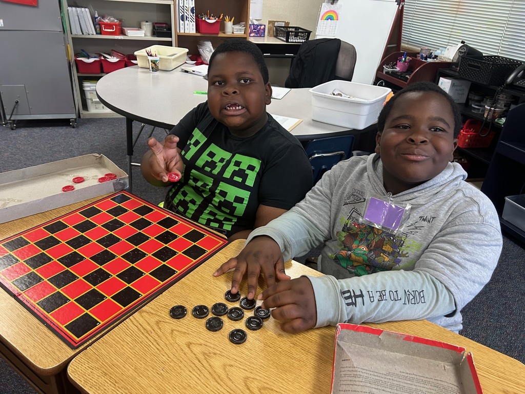 Students playing checkers