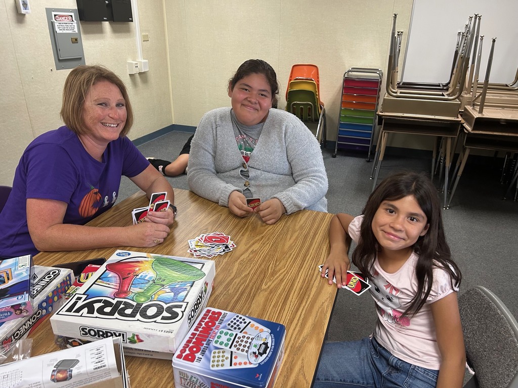 Students and staff playing board games