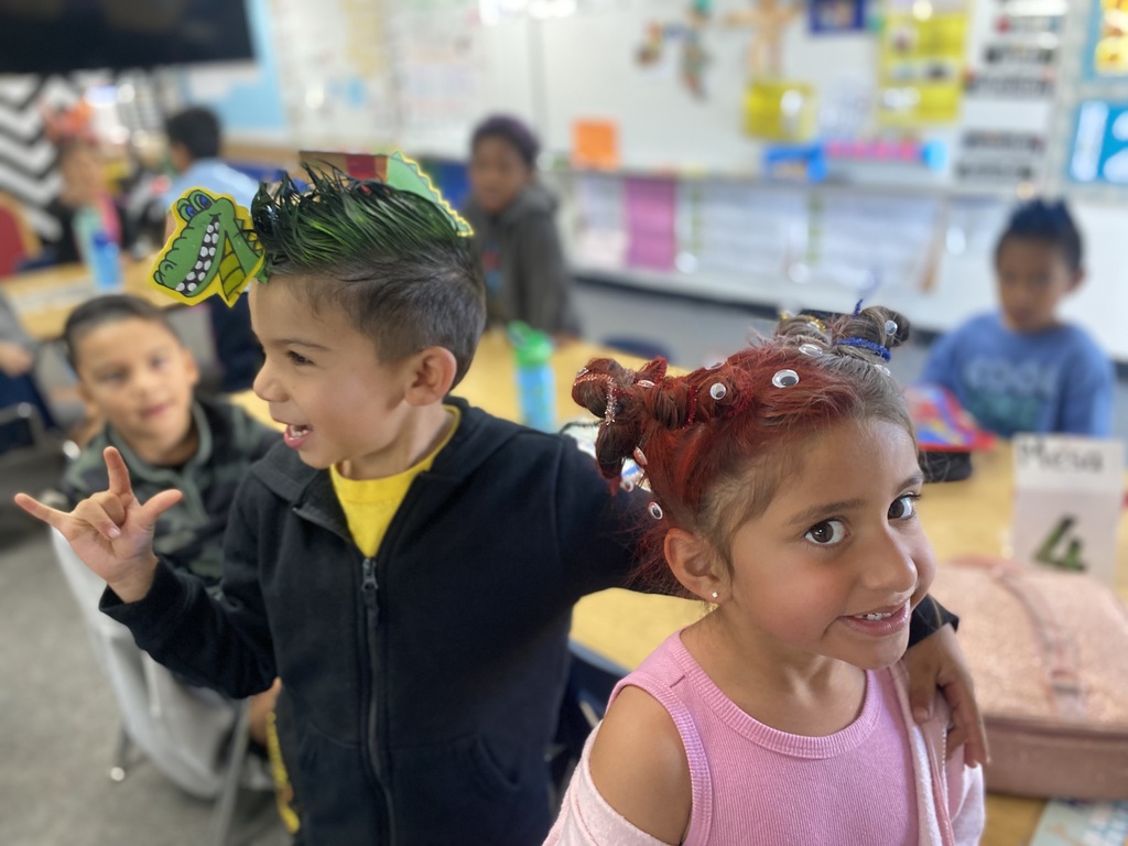 student with red hair and other one with green