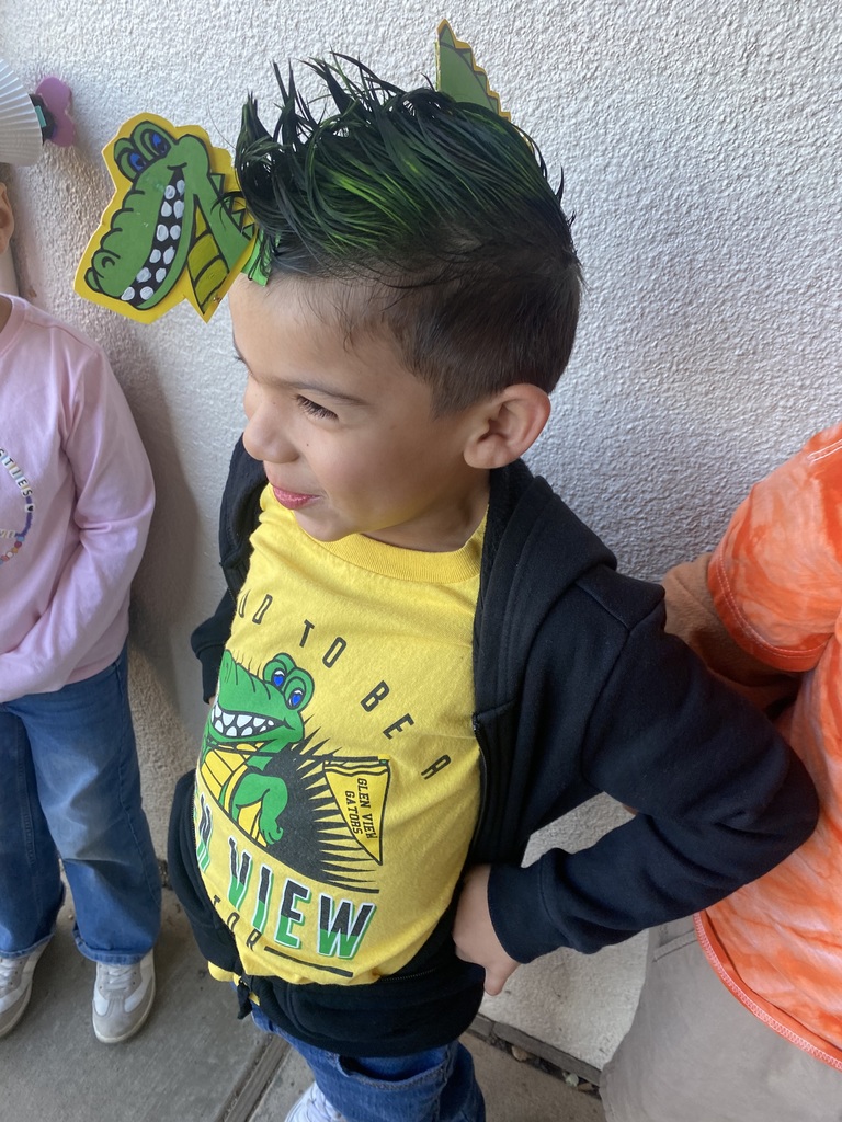 student with green hair and a gator