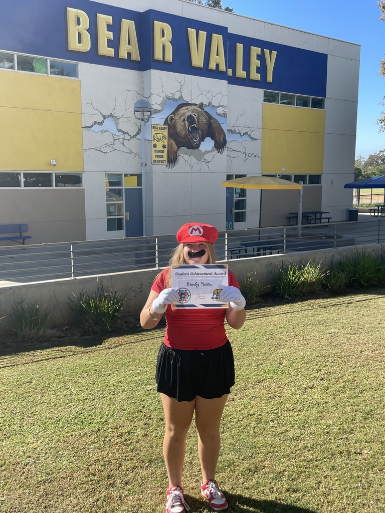 Picture of student holding an award
