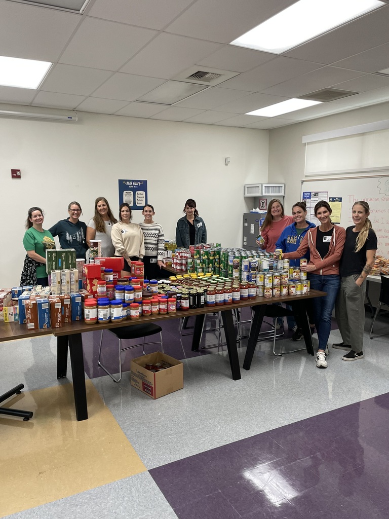 PTA members standing in front of donated food