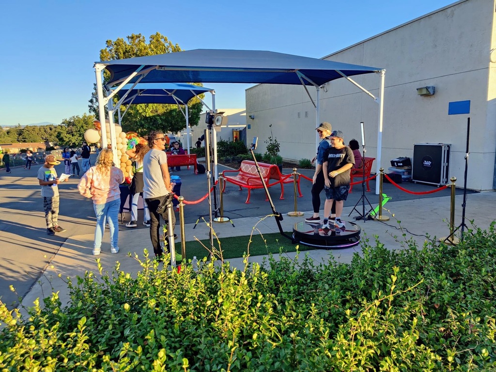 Fall Fest parent & student on the 360 degrees photo booth