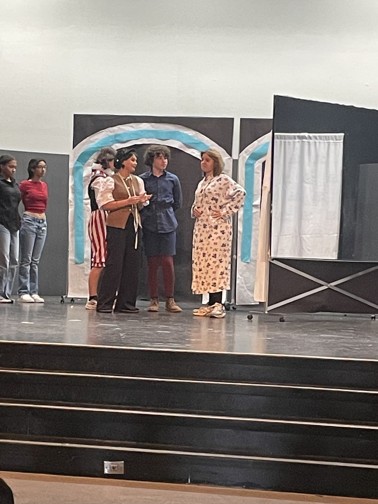 students acting on stage