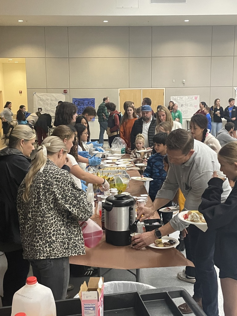 families going through the breakfast line at awards ceremony