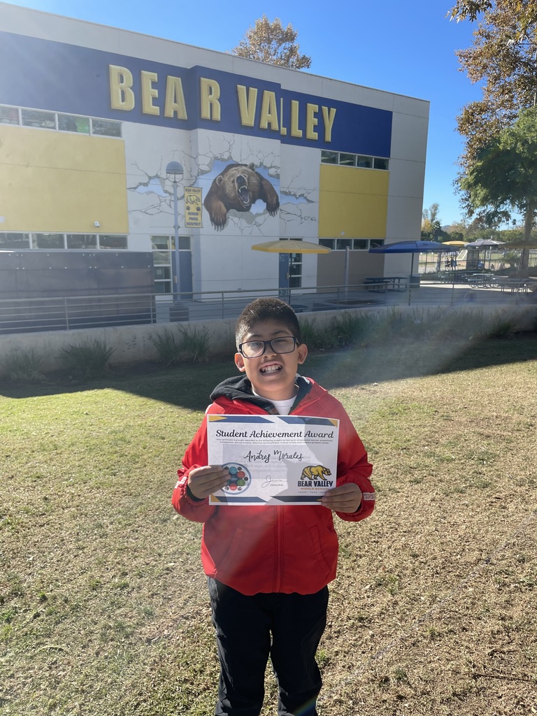 picture of student with award