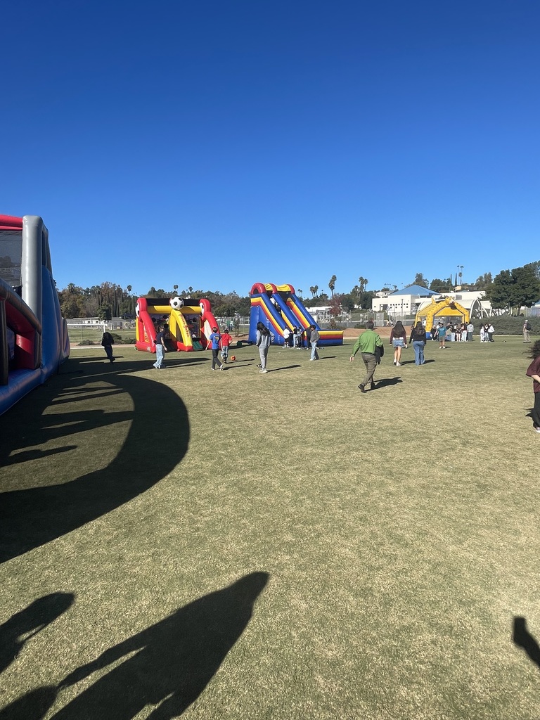 Students and inflatables on field