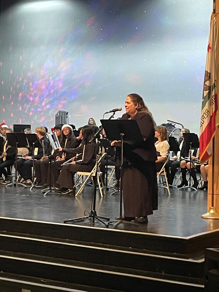 Mrs Thicksten on stage with her band students