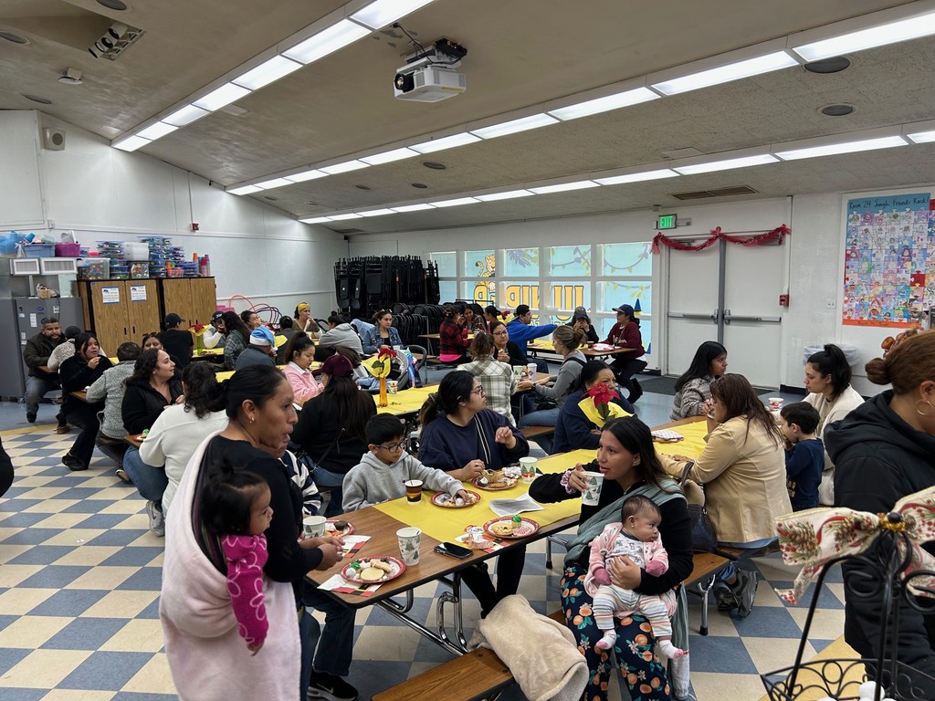 Families eating cookies and drinking coffee
