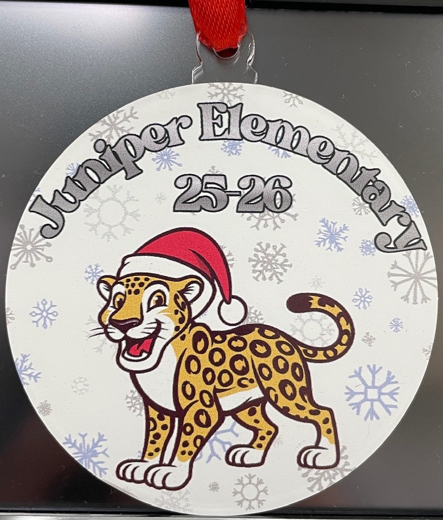 Circular ornament with a jaguar in a Santa hat, snowflakes, and the text "Juniper Elementary 25-26."