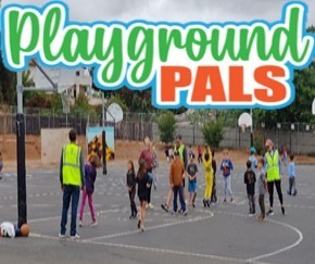 Playground Pals playing basketball with students