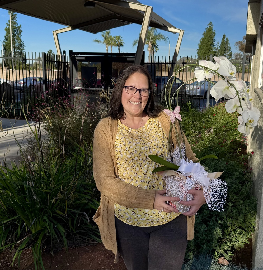 Mrs.Chavarin posing with her orchids