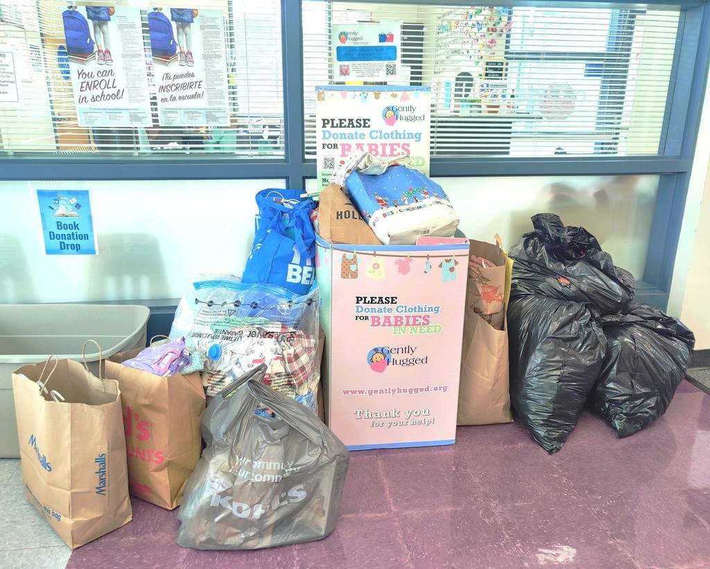 Bags filled with baby items that were donated to Gently Hugged