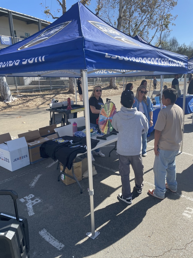 Students spinning a wheel for prizes