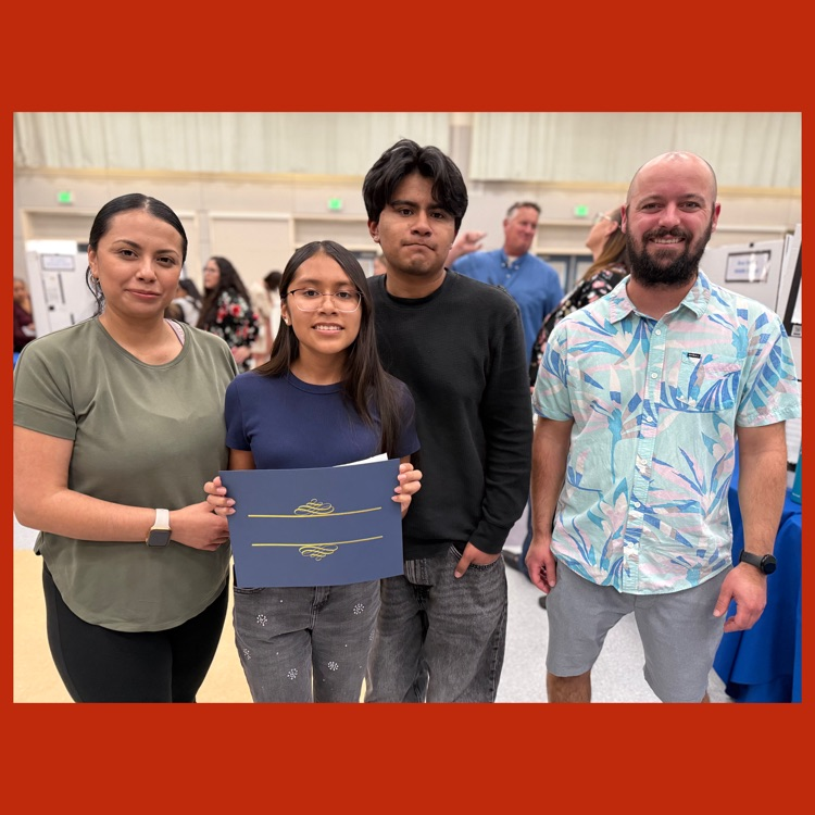 6th Grader Genesis V., her family, and her ELA teacher, Ben Lindley
