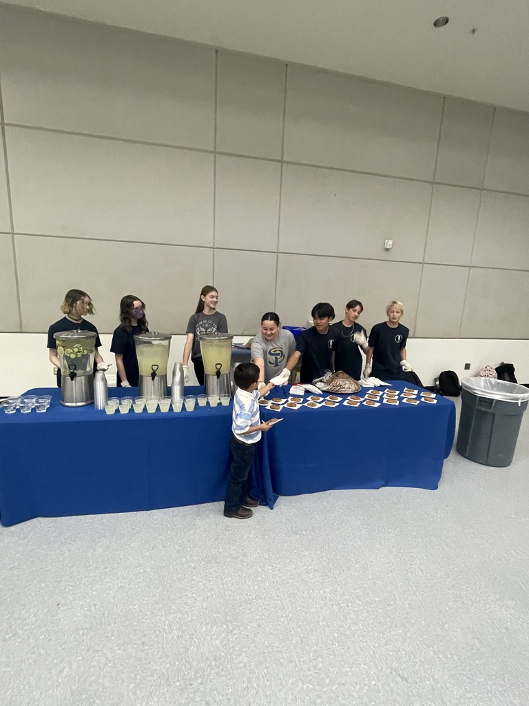 students serving food and drinks