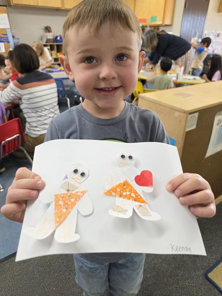 Child holding art work 