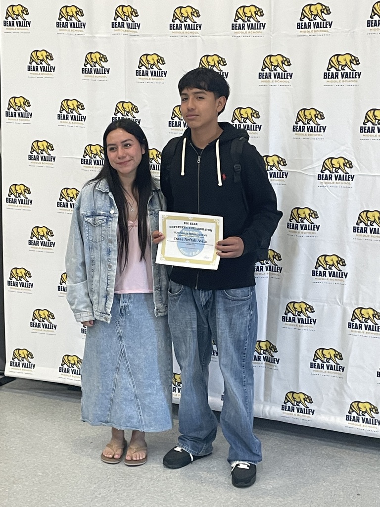 student and parent with award