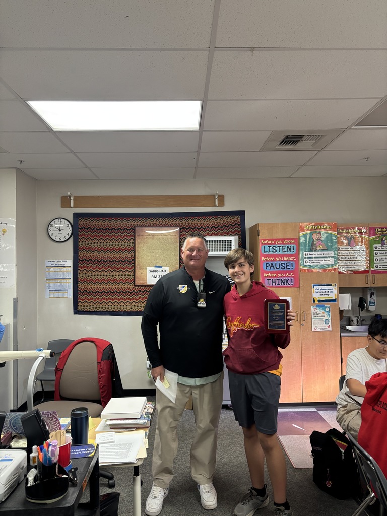 Student receiving award from principal