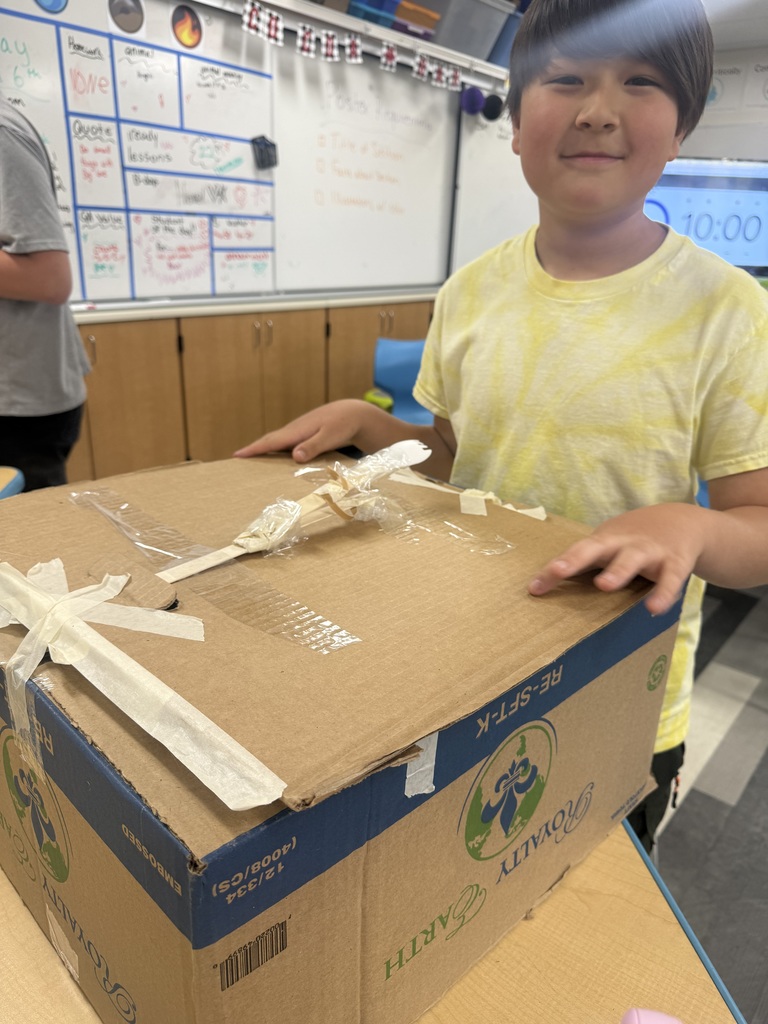 student with their catapult
