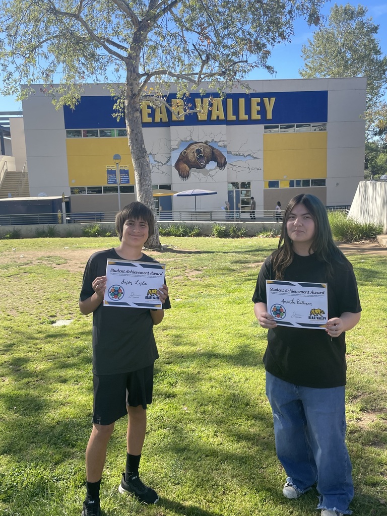 students holding awards