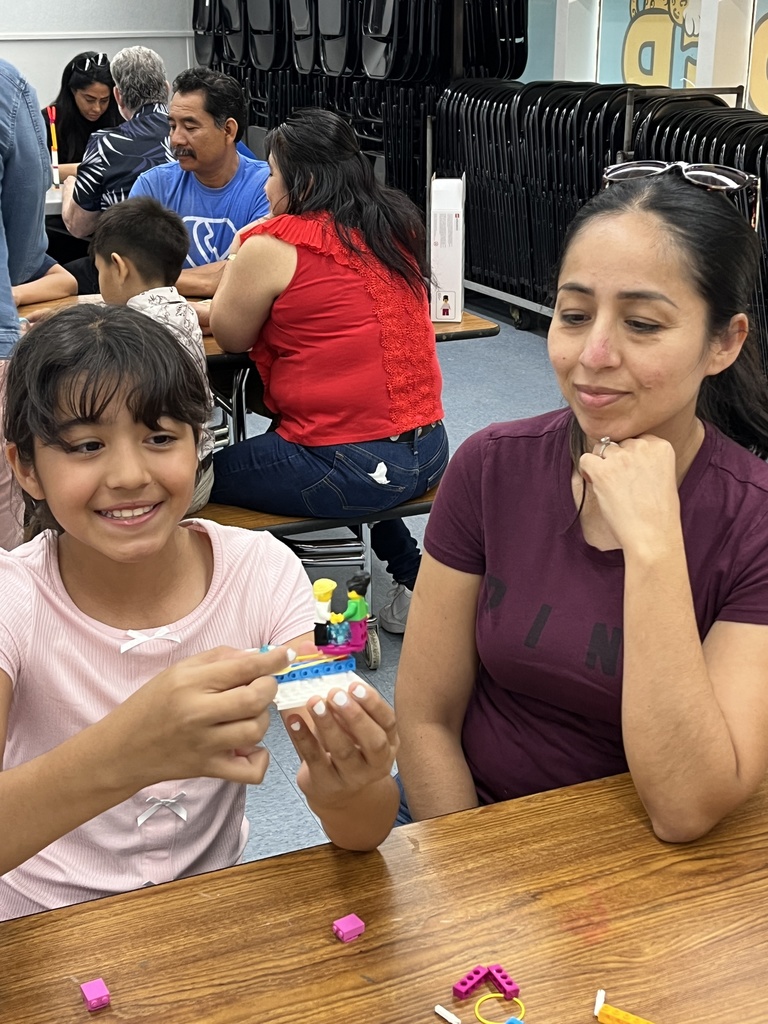 Parents and students working with Legos