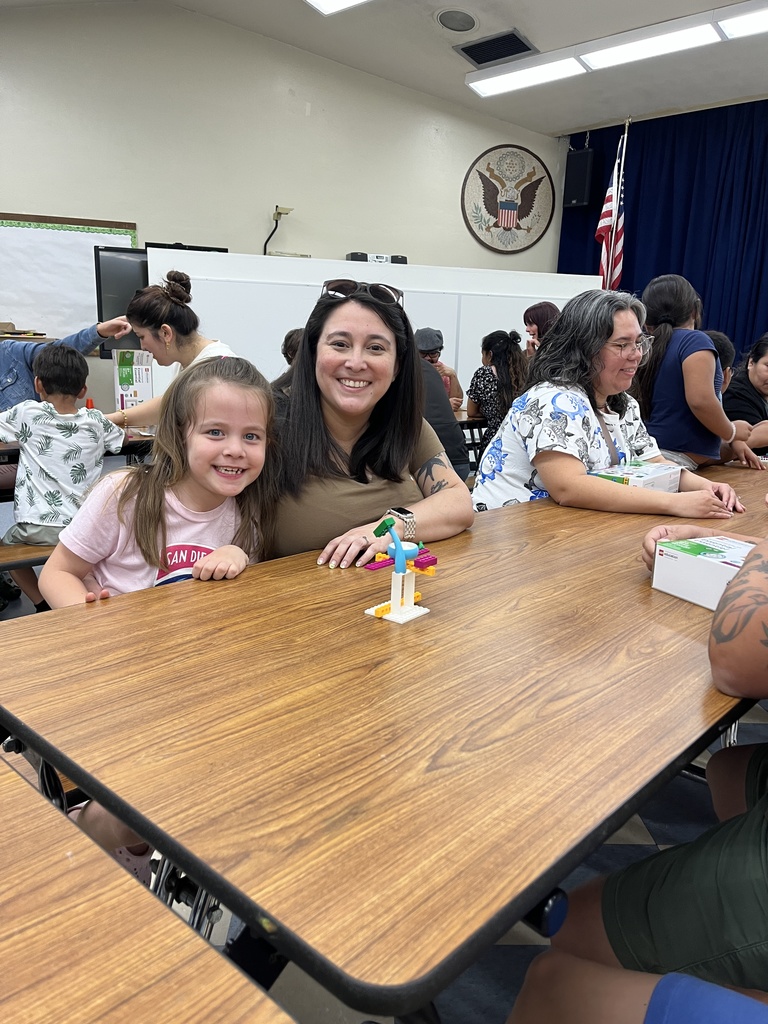 Parents and students working with Legos