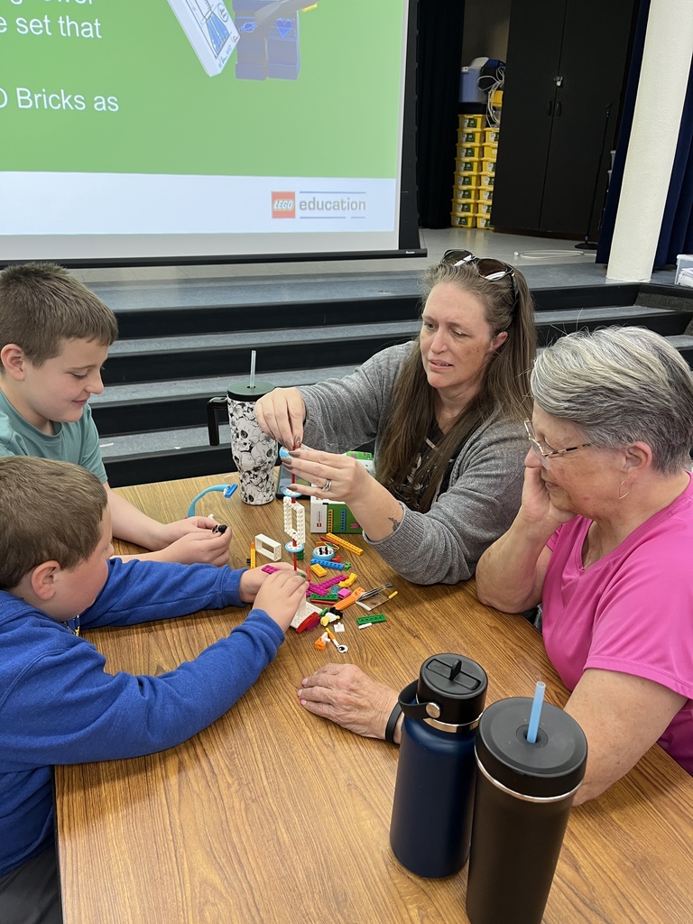 Parents and students working with Legos