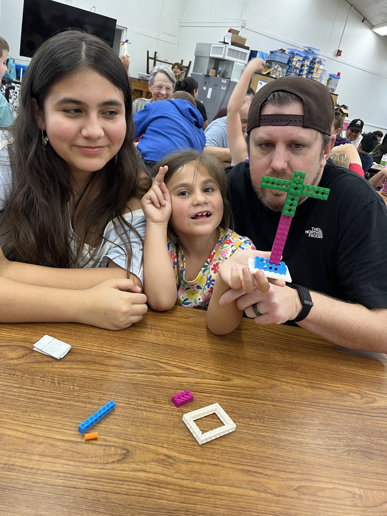 Parents and students working with Legos