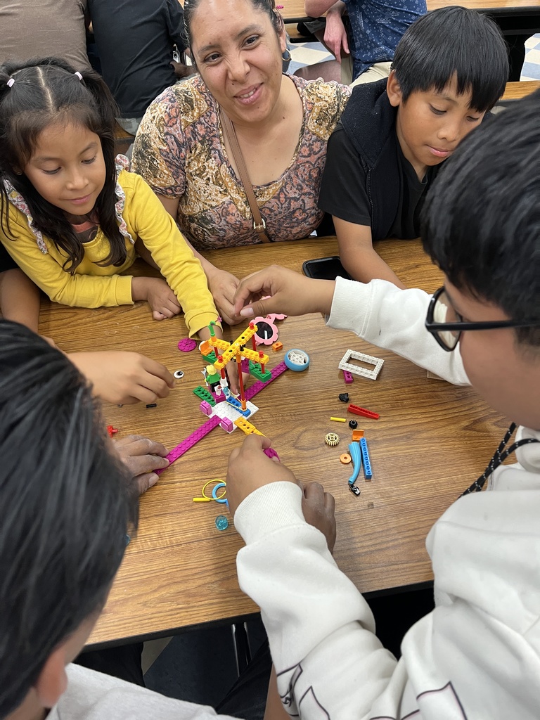 Parents and students working with Legos